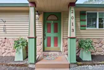 You’ll find an embracing welcome in the details—each pillar and bloom hinting at the comfort inside and outside.