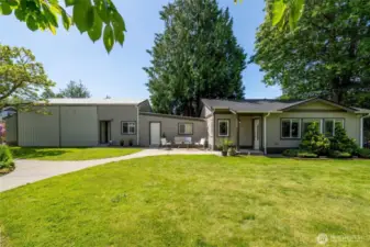 View of the shop, studio/office with full bathroom, storage room, and the beautiful ADU. Perfect for multigenerational living or live in the ADU or main house and rent the other out for income. ADU sits back on the property and has it's own paver patios.