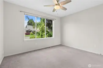 Bedroom #2 w/Ceiling Fan overlooking front yard.