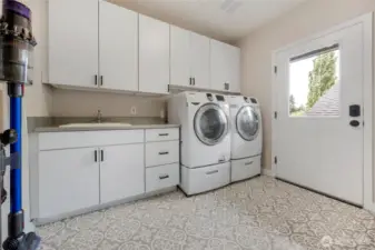 The laundry room is expansive.   It is also where the generator panel is kept.