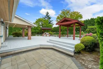 Entrance to back of house from driveway leading to partially covered deck. Sit out in the rain listing to it come down while staying dry &/or eating outside.