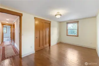 Bedroom at opposite end of hallway from primary bedroom