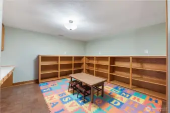 Game room with storage room for books & built in study desks on the left