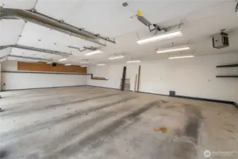Inside 4 car garage with heater showing top right.