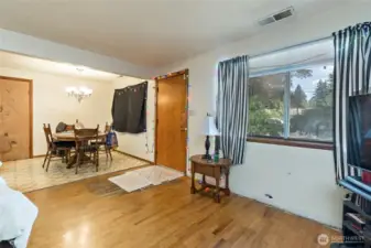 Looking at the dinning room and front door front the living room