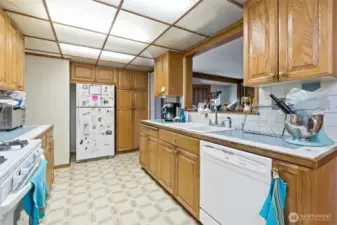 Kitchen with pass through window to family room