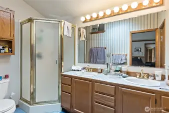 Primary bath with double sinks and walk-in closet