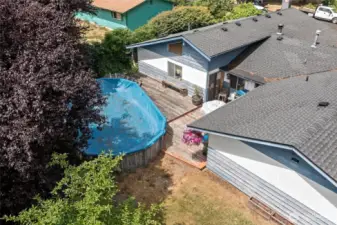 Above ground pool with wide steps leading up to it