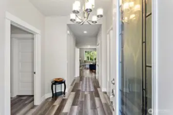 Spacious entry with high ceilings and stunning engineered hardwood floors.