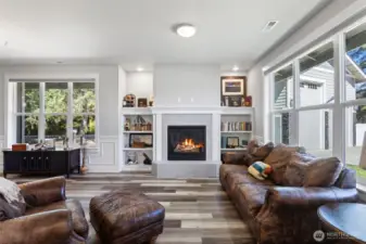 The first living space just off the main entrance with custom built ins, gas fireplace, and loads of natural light.