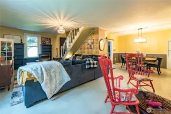 Open living and dining room areas. Barn door in dining area provides you another access point to the remodeled kitchen (first at the bottom of the stairs).