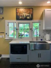 Enjoy looking out to the lush backyard landscaping from your kitchen.