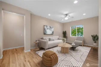 Spacious bonus room with hardwood floors, perfect for use as an office, additional living space, or entertainment area.