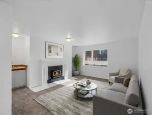 Warm wood burning fireplace in the spacious living room with large windows to bring in natural light!