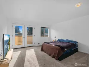 Very spacious primary bedroom with French doors lead to private balcony to take in territorial & sunset views!