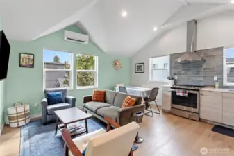 Cozy kitchen with SS appliances and engineered hardwoods.