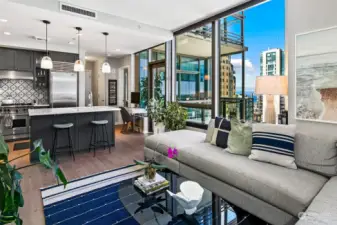 Walls of windows allow great natural light and peekaboo views of downtown and the waterfront from inside the condo.