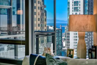 Walls of windows allow great natural light and peekaboo views of downtown and the waterfront from inside the condo.