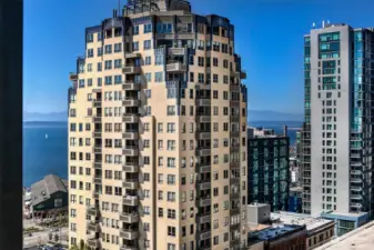 Walls of windows allow great natural light and peekaboo views of downtown and the waterfront from inside the condo.