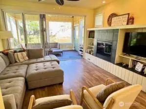 Great Room offers electric fireplace and custom built-ins.