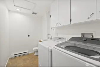 Laundry room with half bathroom