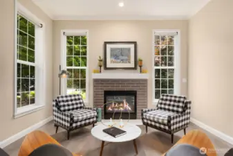 Walls of windows and a cozy gas fireplace create a warm, inviting ambiance.