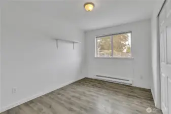 Bedroom, with upgraded flooring.