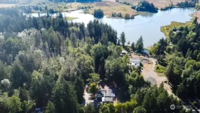 100 ft of Mudd Bay waterfront and private beach