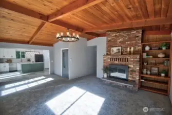 Great room with brick fireplace with wood insert