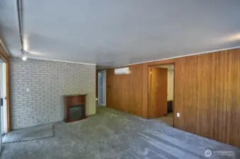 Primary bedroom with sliding glass door, walk-in closets and fully remodeled bath.