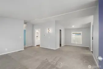 View from living room with flex space - dining, sitting area? Laundry room to left of the sitting area.
