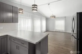 Kitchen looking toward large dining area / flex space.