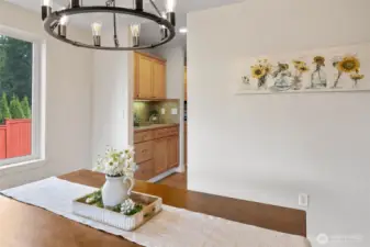 New Chandelier with dining room leading into butler pantry