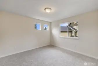 Generous sized Bedroom, with nice lighting, new trim and extra upgraded padding underneath all new carpeted upstairs!