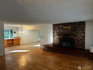 Front living room with massive fireplace hearth