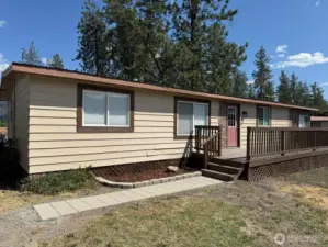 Large TREX deck on front of home