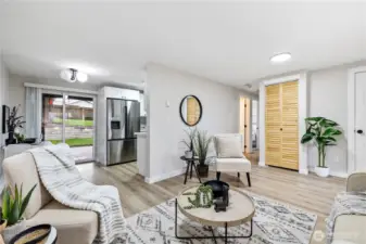 Living Room, Laundry Hookups Behind Wood Door