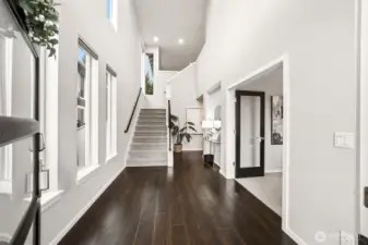 Large entryway with vaulted ceilings and remote controlled window shades