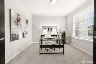 Main floor office or den space with french doors