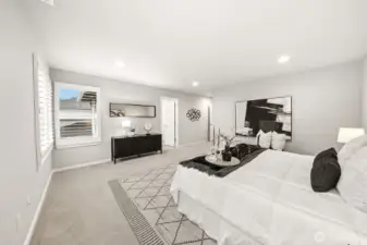 Primary bedroom and bathroom include custom shutters