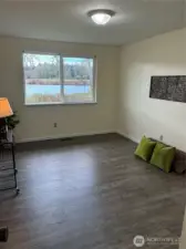 Primary bedroom suite enjoys lake views