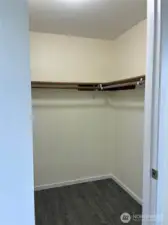 Primary bedroom walk-in closet