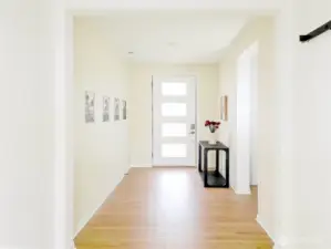 Entryway. Doorway on the right goes to the main floor 3/4 bath and guest bedroom.