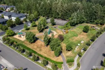 The entrance park to The Bridges. Playground, athletic court, and plenty of green space to play and picnic. This is one of several parks in the community, including dog parks/dog runs, as well as walking trails.