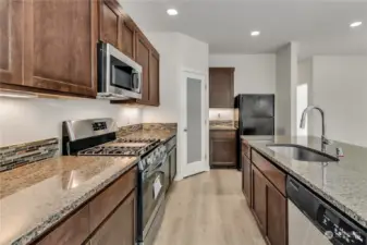 Plenty of Kitchen storage with cabinets and nice sized pantry. Lots of functional, well-lit counter space!