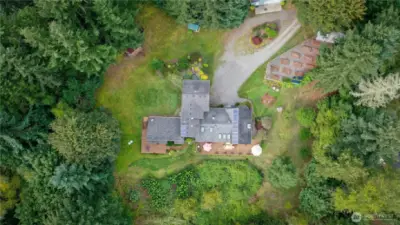 Aerial view of the property. In short, a place where rural quality of life intersects with beautiful living & close-in convenience!