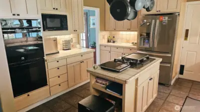 Chef's Kitchen with double oven and gas cooktop. All appliances stay. #10920 Chaucer St SE, Olympia, WA 98501