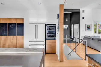 Paper stone, custom lighting, millwork, gas range, CAFE appliances, wine cooler, absolutely stunning!