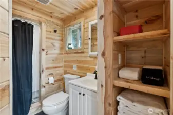 Upstairs bathroom with storage and shower