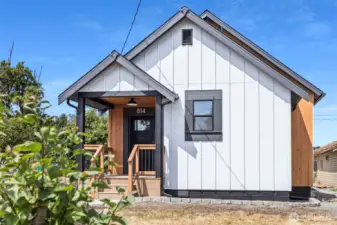 Front Elevation showing the Hardie Board & Batten siding, Pine TIG cladding features and Sherwin Williams paint & stain.